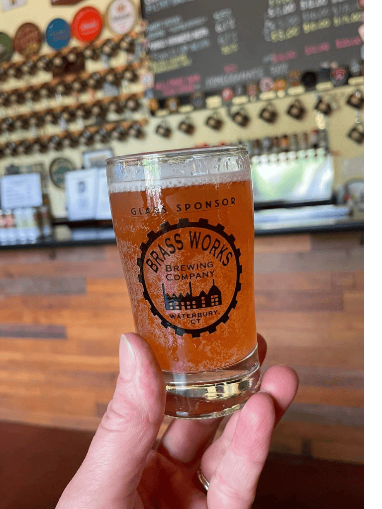 Cold craft beer at Brass Works Brewing Company Waterbury CT, brewery taproom, local beer, craft beer experience.