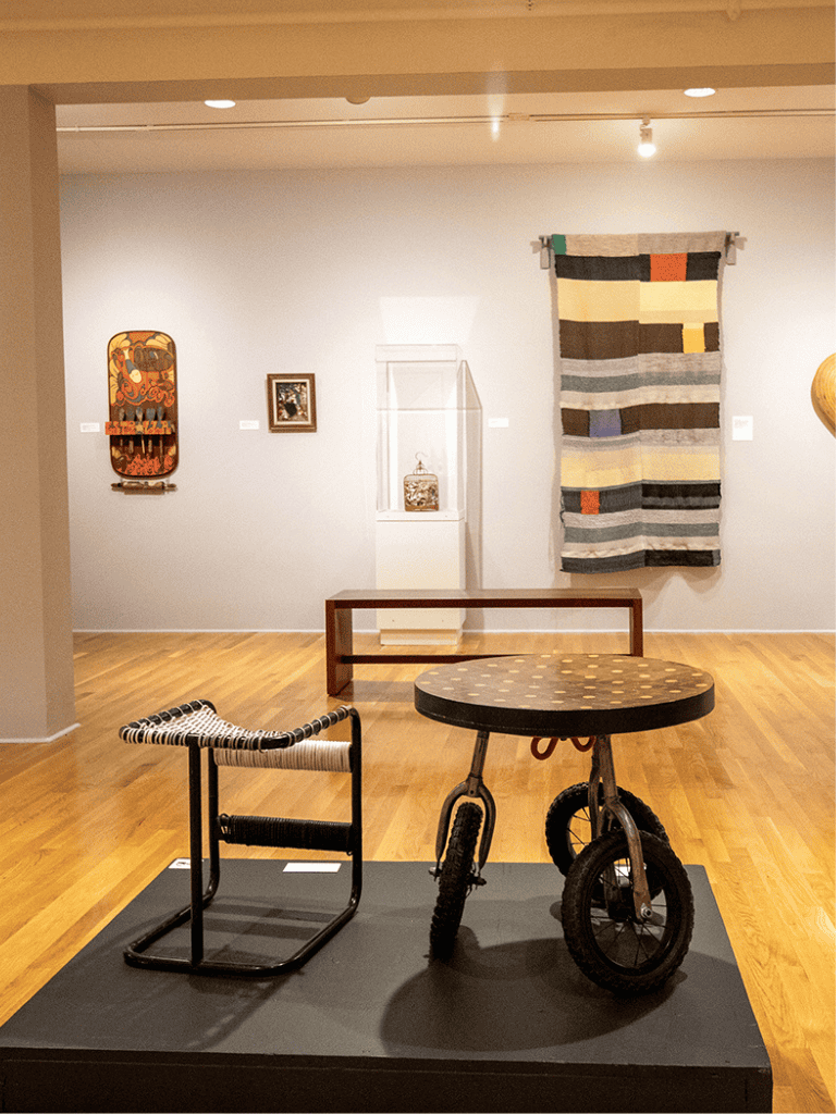 1. Art gallery exhibit featuring contemporary and traditional artwork displays.