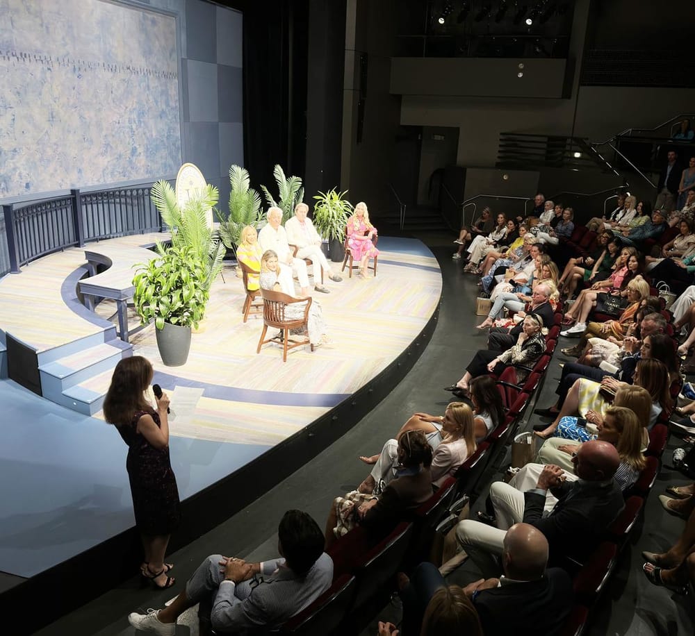 Engaging panel discussion with diverse speakers at Quest for Directions event, audience attentive and engaged.