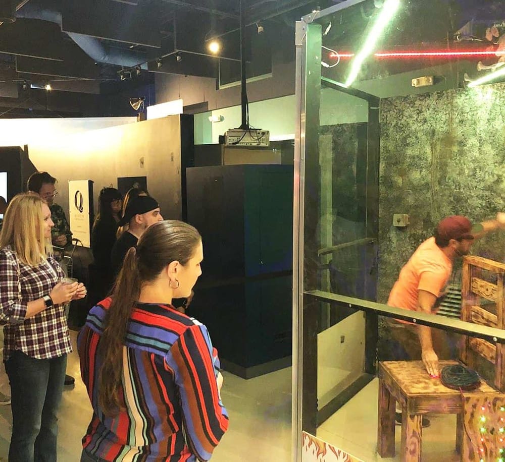 People waiting in line for an immersive experience at Quest for Directions, a popular interactive venue.