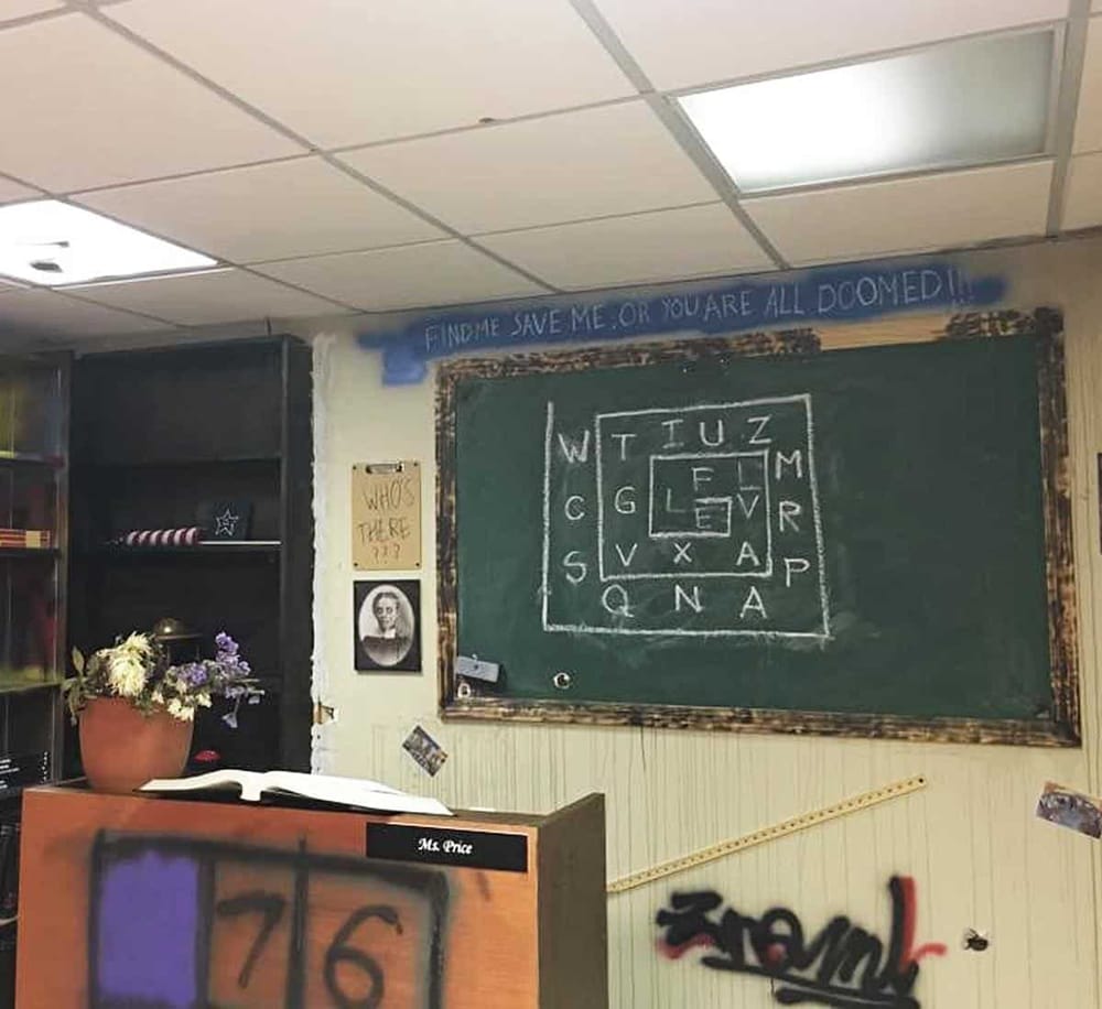 Findme save me or you’re doomed graffiti on classroom wall.