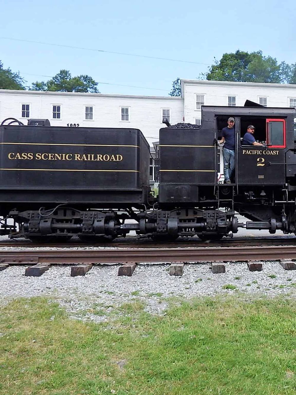 Vintage black Pacific Coast train locomotive at Cass Scenic Railroad, scenic outdoor railway experience.