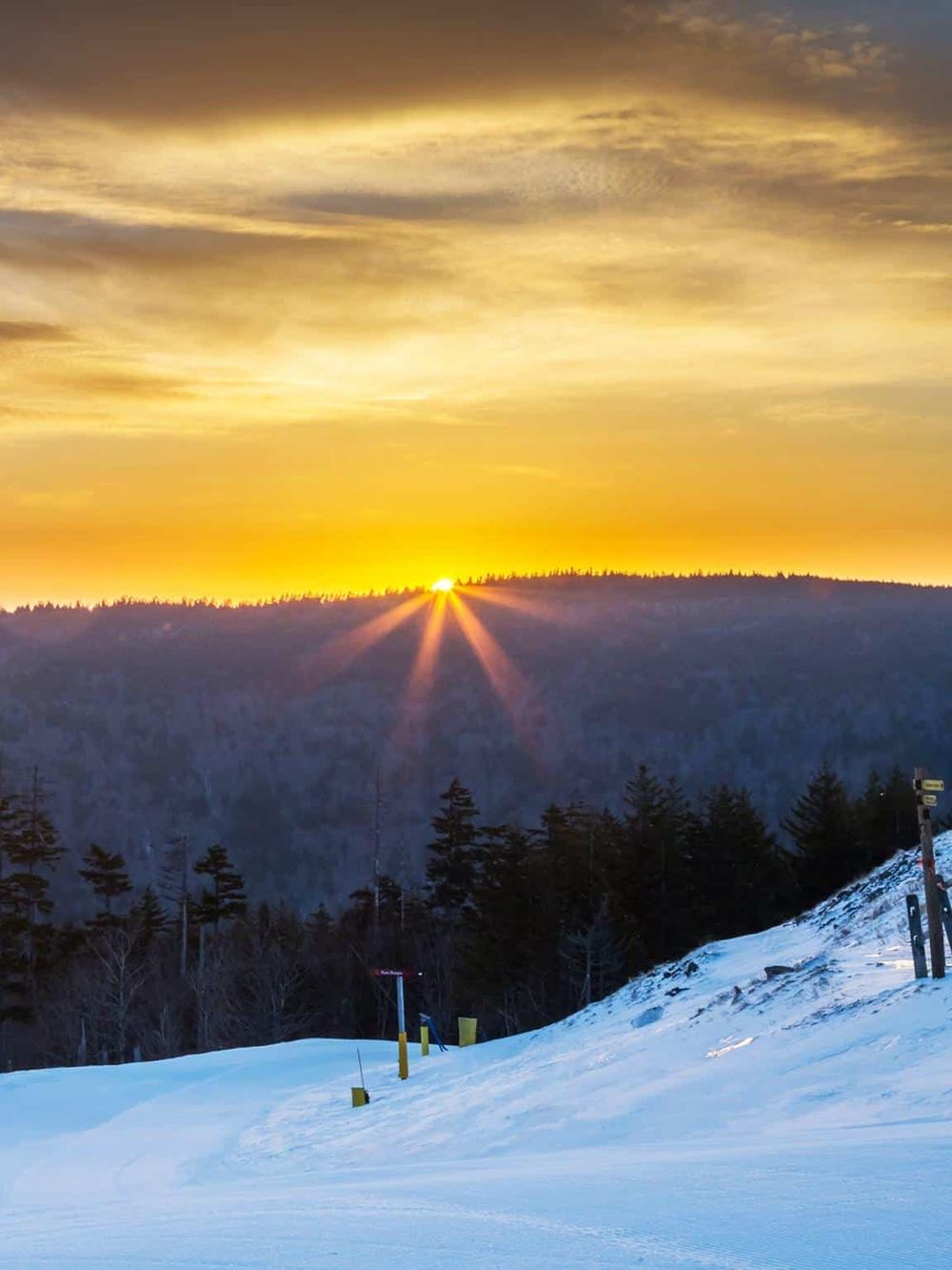 Golden sunset over snowy mountain landscape in Napa, California.
