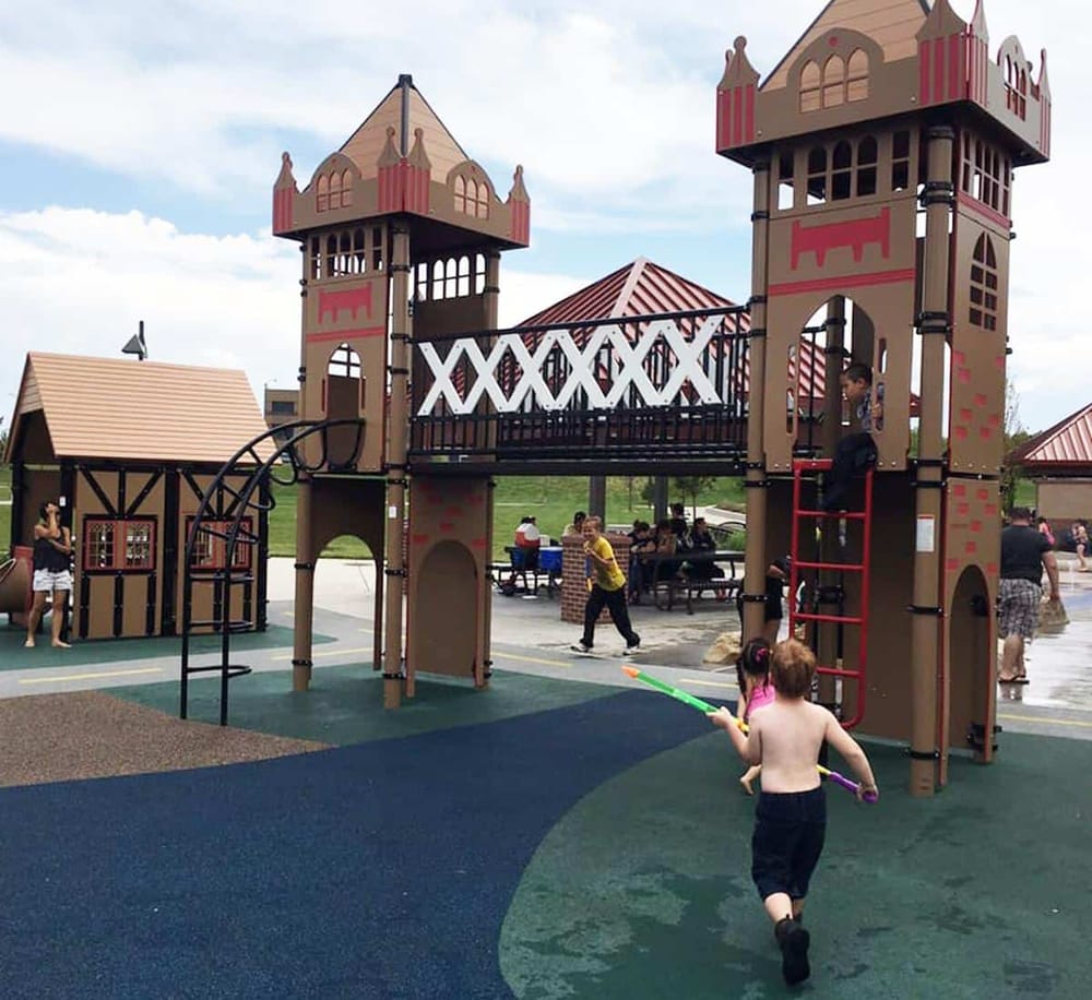 Colorful playground castle for children at Quest for Directions park, fun outdoor activity for kids.