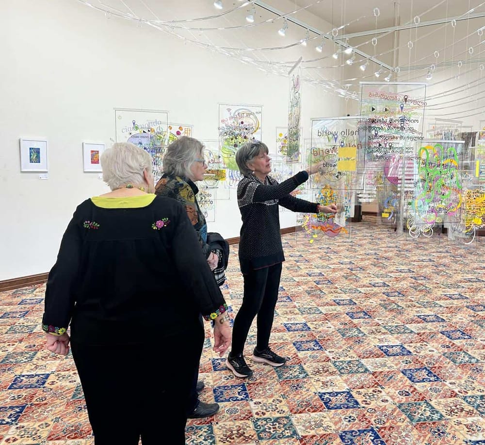 Colorful art gallery with visitors exploring innovative digital art installations.