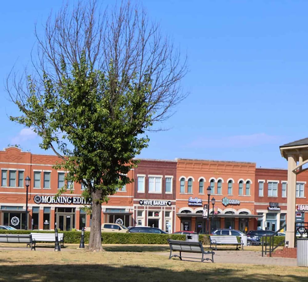 Bright downtown shopping district with unique stores and cafes, perfect for local exploration and directions assistance.