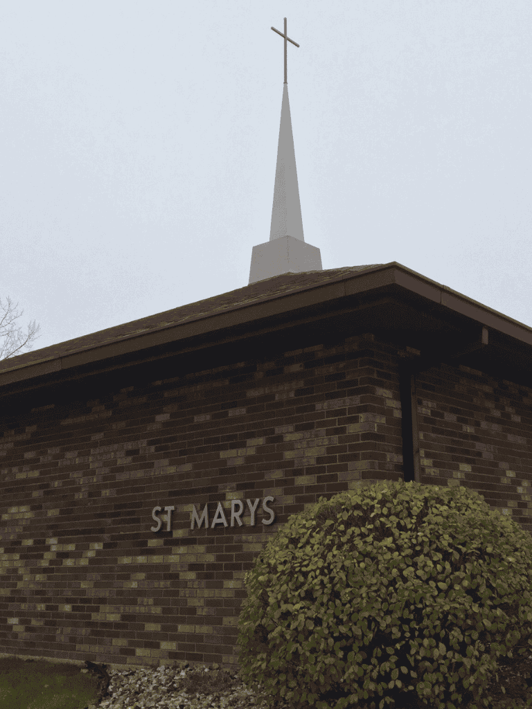 Historic church with steeple and cross, providing spiritual guidance and community support.