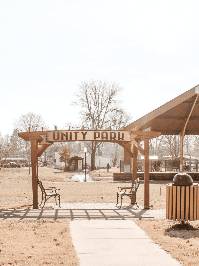 Gateway to Unity Park, outdoor community space with benches and park features.