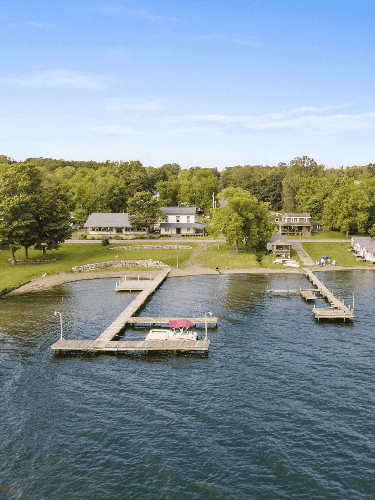 Serene lakeside retreat with private docks and lush greenery at QuestForDirections.