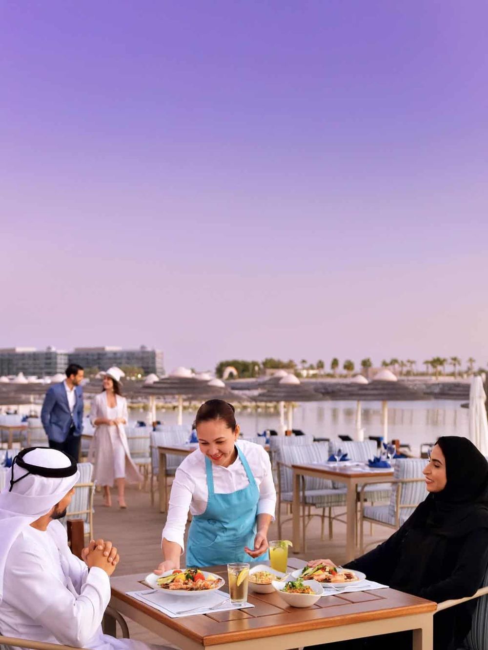 Elegant beachfront restaurant with diverse cuisine and outdoor dining experience, perfect for travelers seeking culinary adventures.