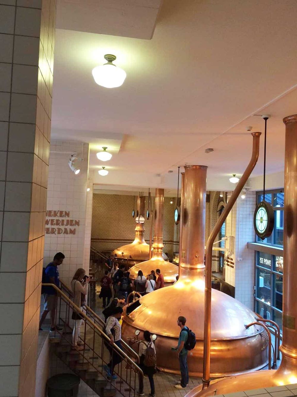 Copper beer brewing tanks at Quest For Directions in Amsterdam, providing an immersive brewery experience.