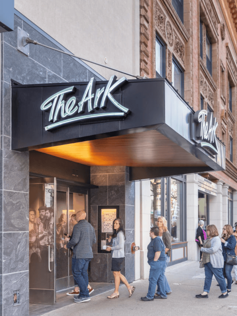 Modern nightclub entrance with people queueing outside for a night out at The Ark.