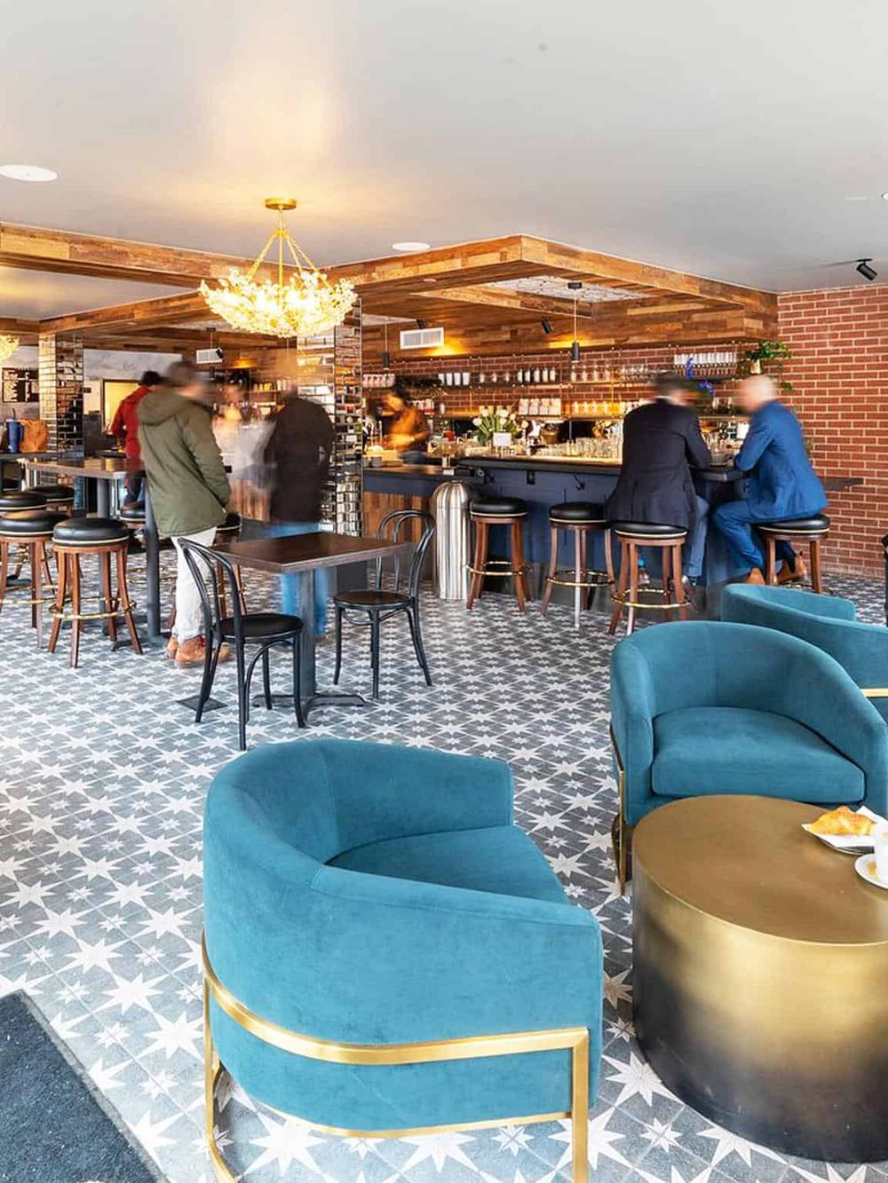 Stylish bar and lounge area with vibrant seating, modern decor, and inviting atmosphere for socializing.