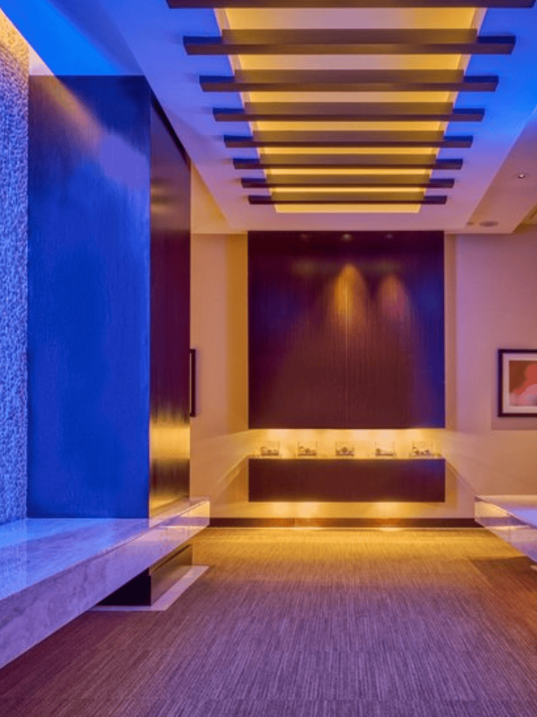 Modern hotel lobby with ambient lighting and contemporary decor - perfect for travelers seeking comfort.