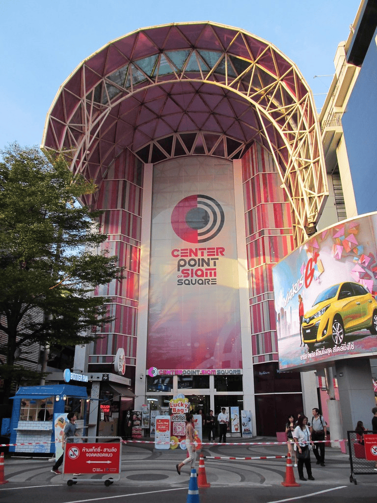Bright city center point of Siam Square with colorful signage and modern architecture.