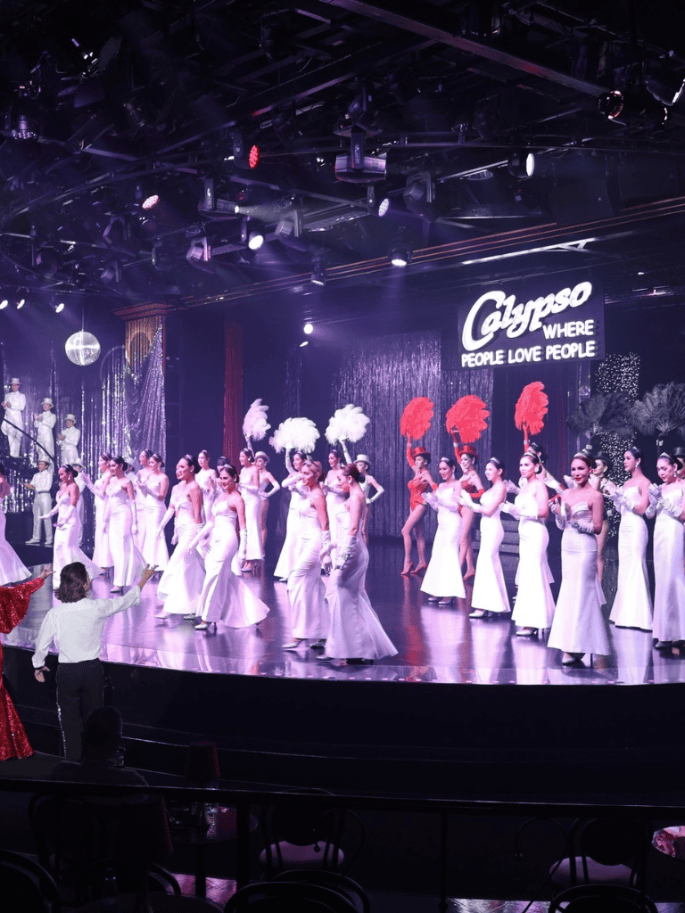 Elegant stage performance at Gypsy nightclub, showcasing lively dance and entertainment in a vibrant nightlife setting.