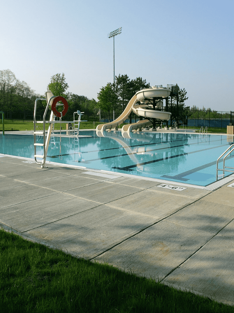 Water park with water slides and swimming pool for family fun and recreation.