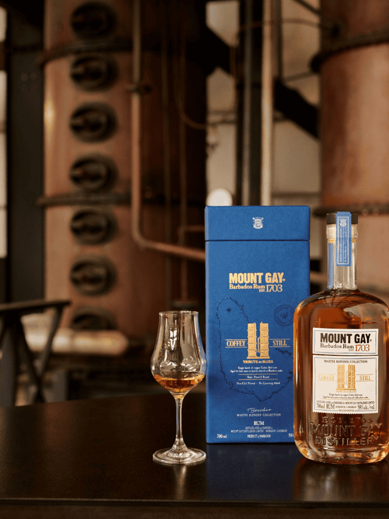 Rich Mount Gay Barbados Rum with accompanying glass in a stylish bar setting.
