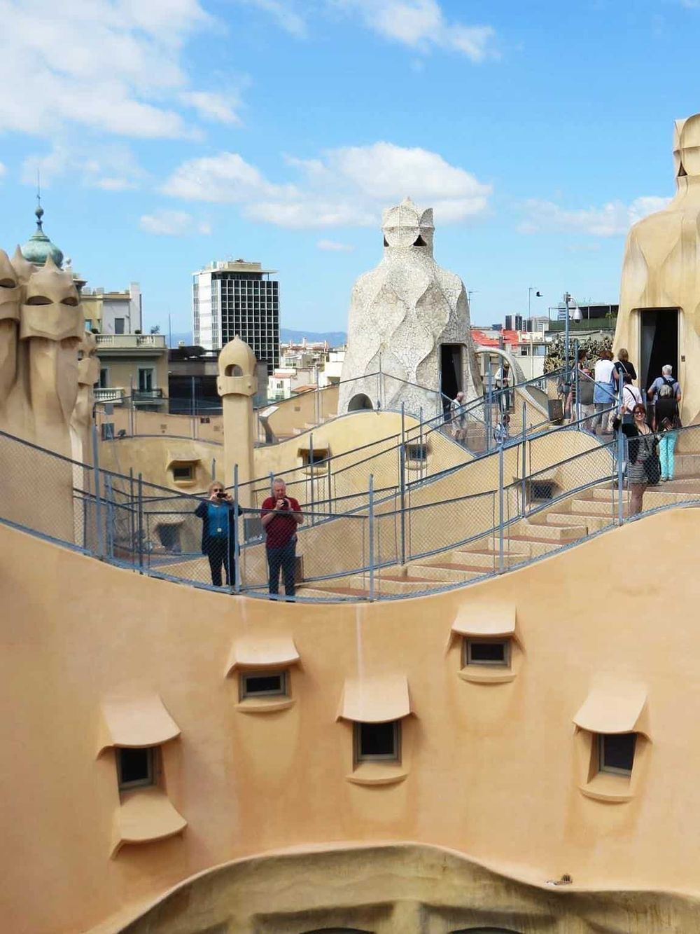Colorful rooftop view of Casa Batlló, famous architectural gem in Barcelona, Spain.