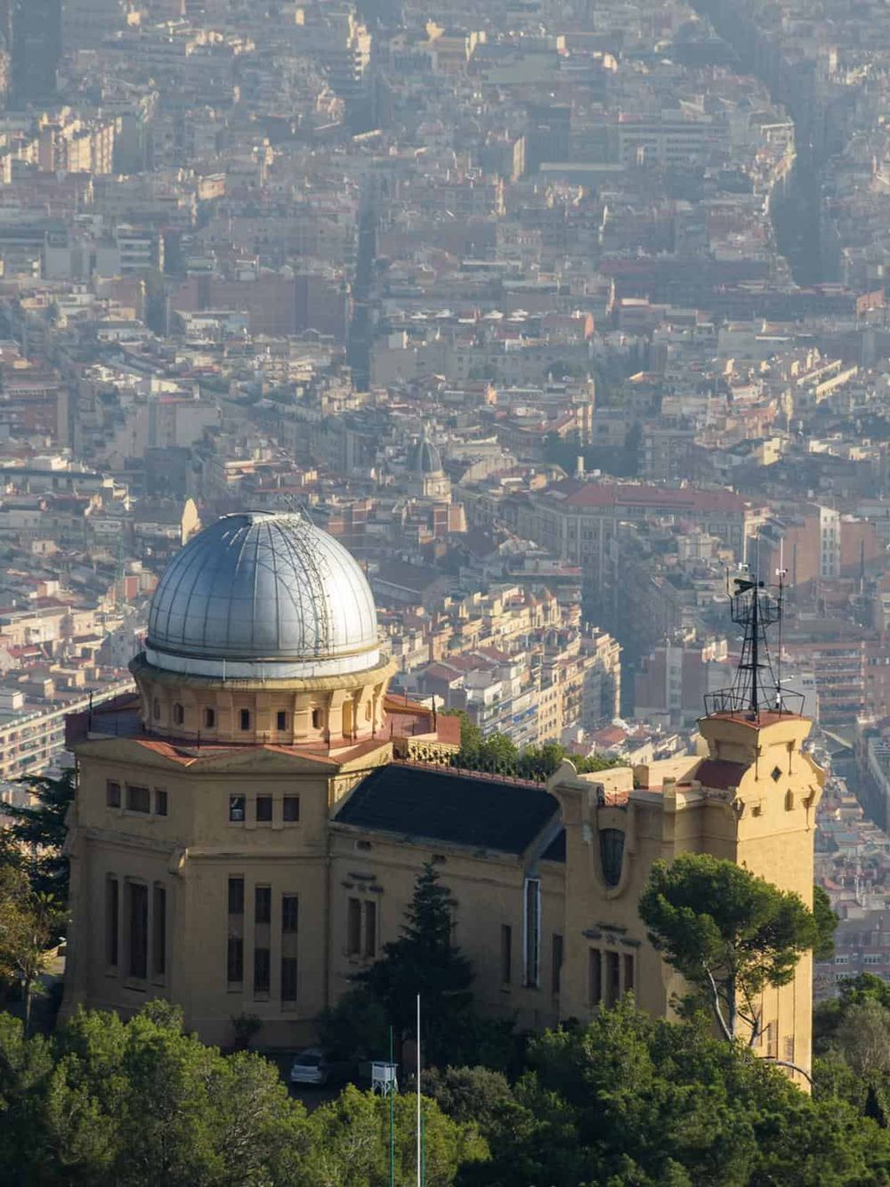 Dome on the Griffith Observatory overlooking Los Angeles cityscape.