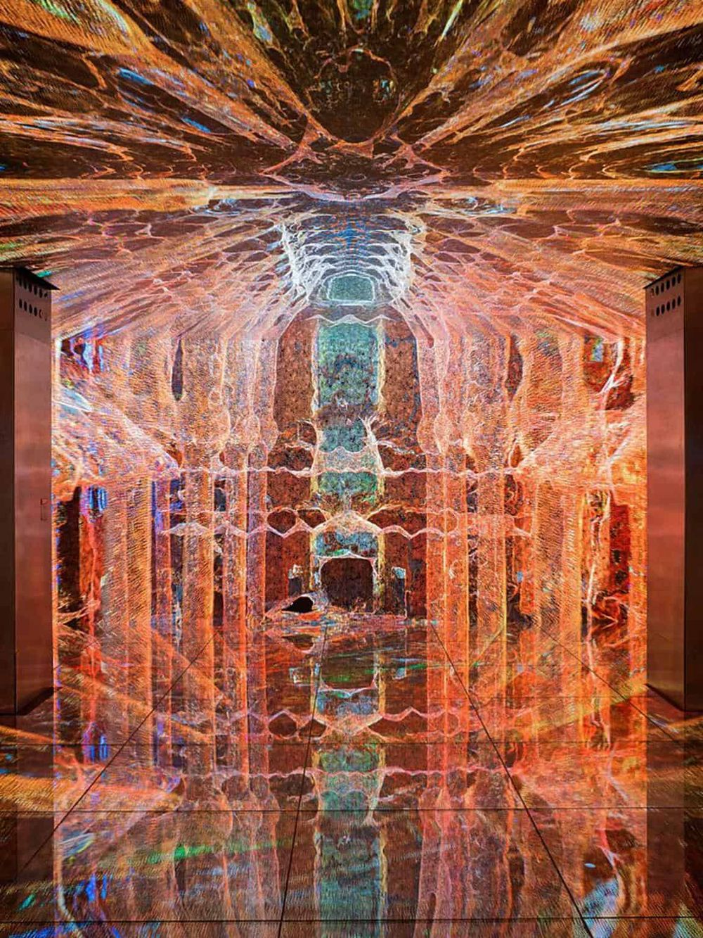 Colorful abstract art installation with vibrant lights and reflective surfaces, creating a mesmerizing visual experience.