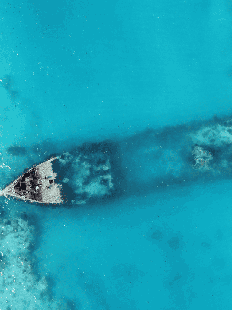 High-speed boat in turquoise water, demonstrating navigation and adventure travel.