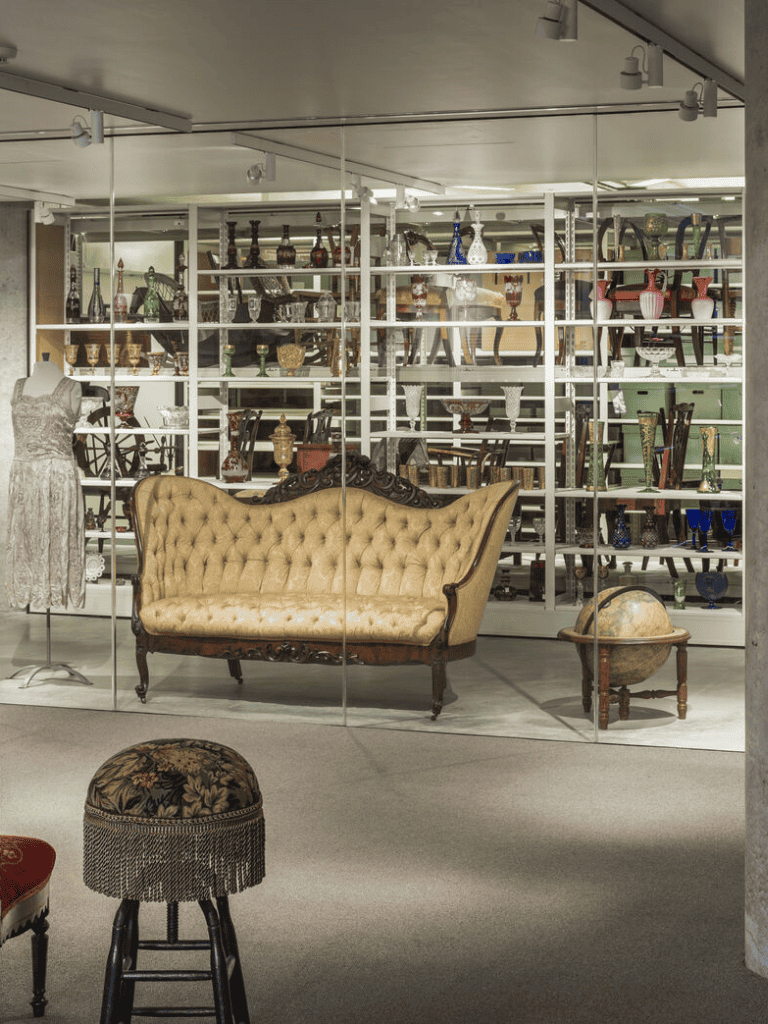 Vintage antique furniture and decorative items displayed in a stylish showroom.