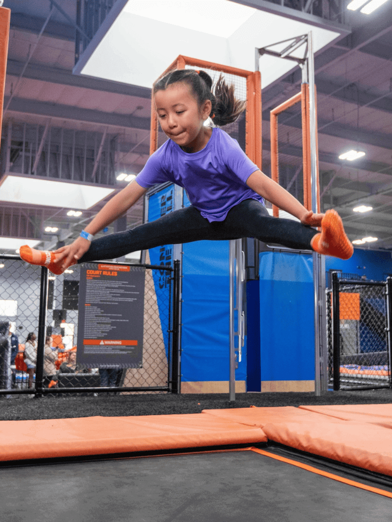 Kids trampoline jumping at QuestForDirections indoor activity center.