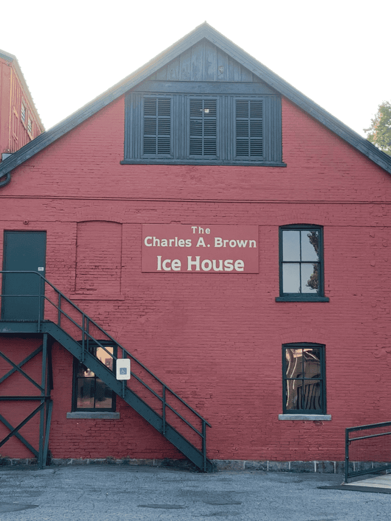 Vintage ice house building at Charles A. Brown Ice House in Quest For Directions website image.