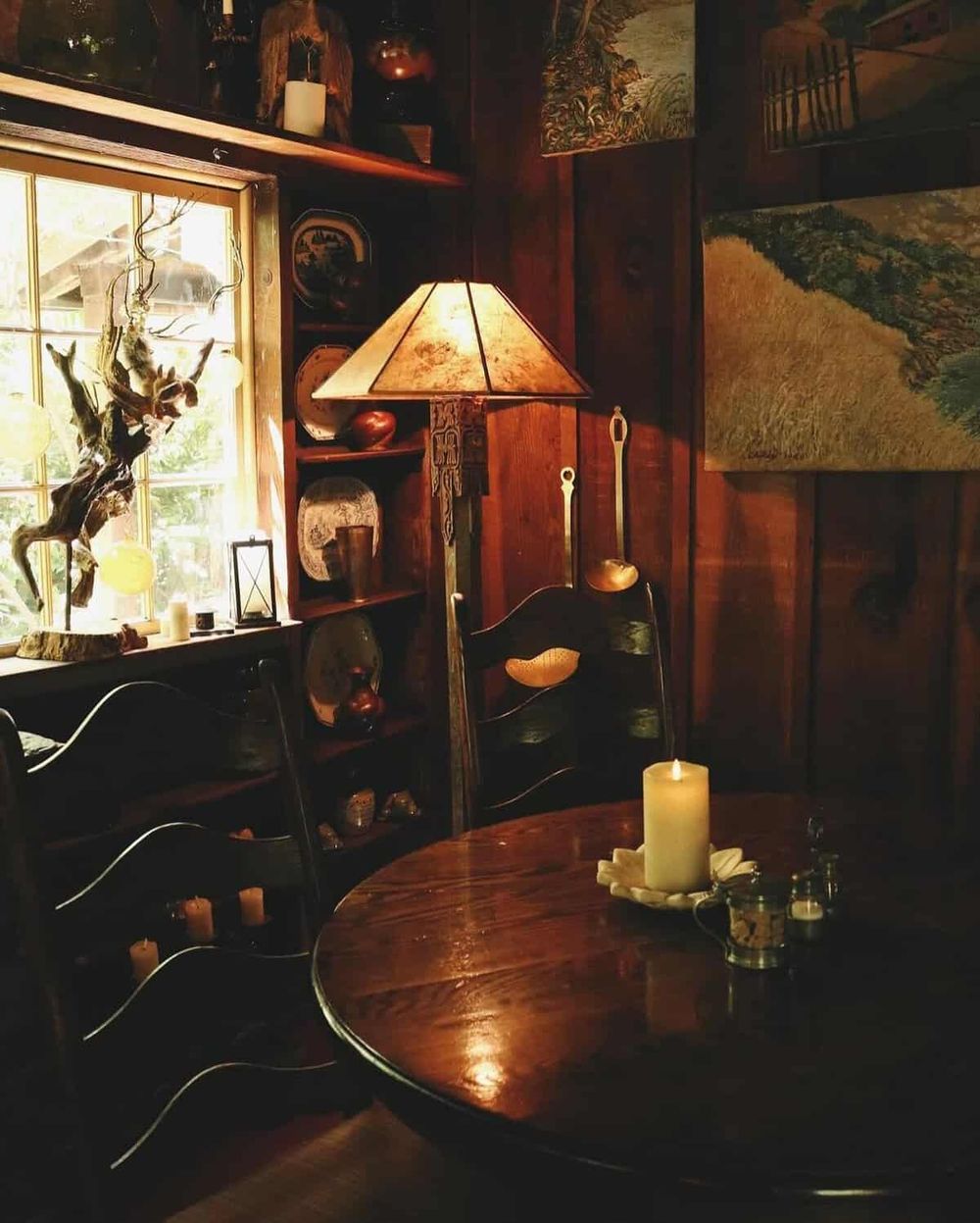 Cozy rustic dining room with warm lighting, wooden furniture, and decorative accents for a homely atmosphere.