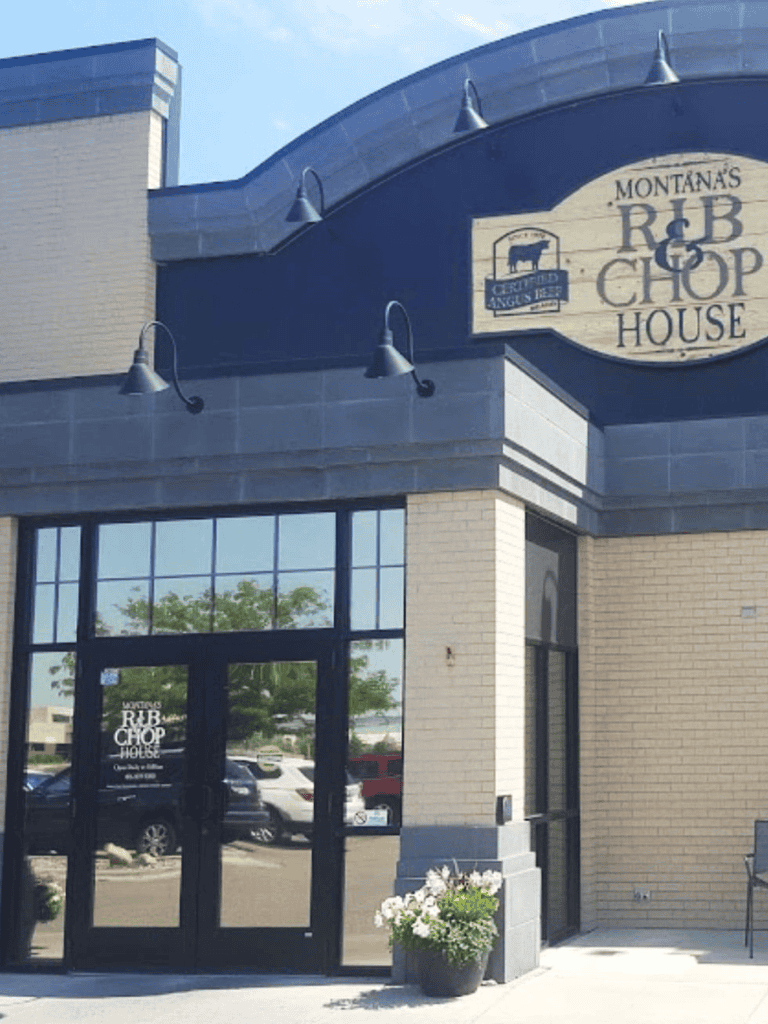 Outdoor view of Montana's RIB & CHOP House restaurant with logo signage and patio decor.