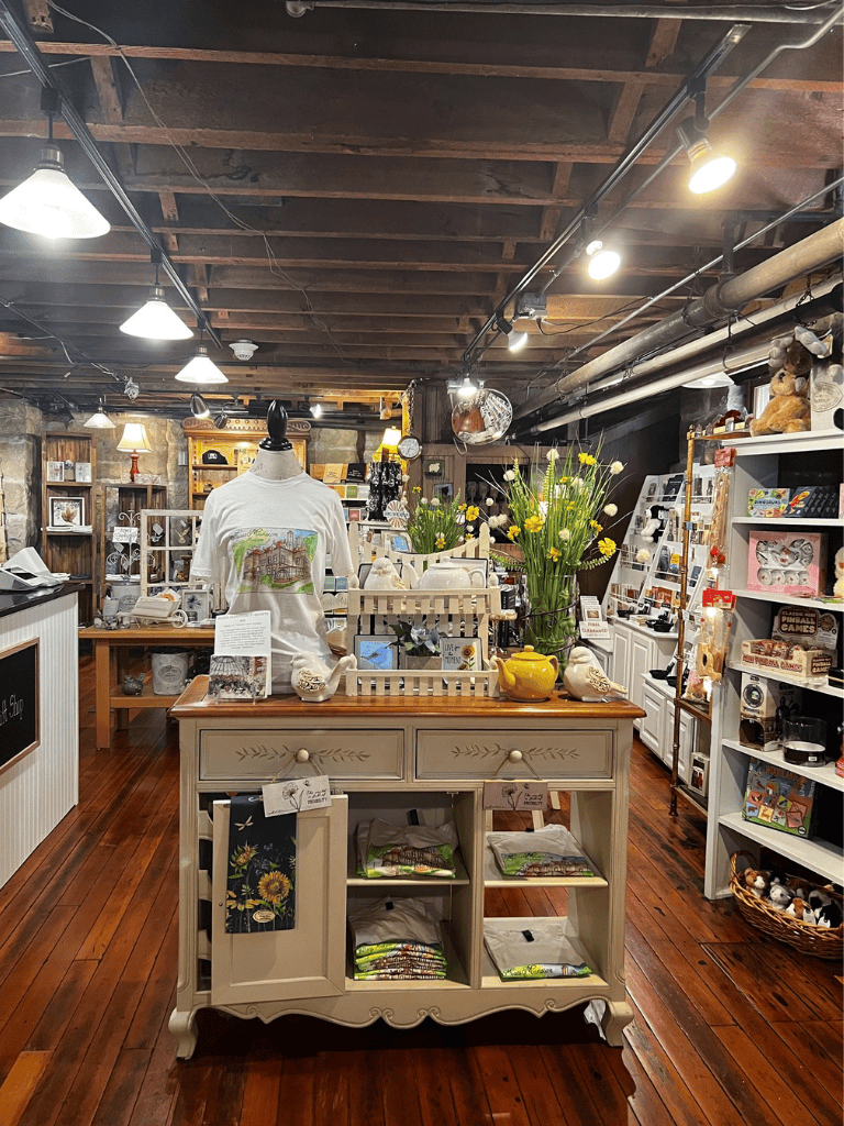 Colorful gift shop interior with vintage decor, handmade items, and unique souvenirs.