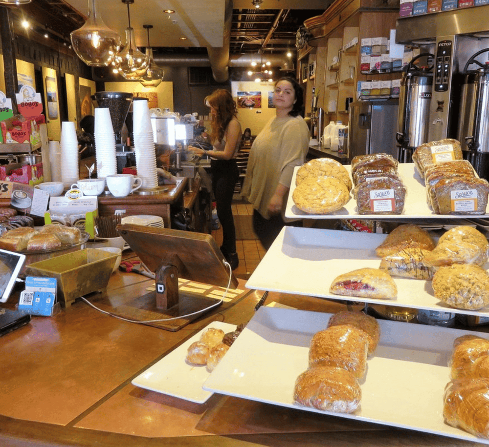 Fresh bakery display at Quest for Directions cafe, showcasing assorted pastries and breads for a cozy breakfast.