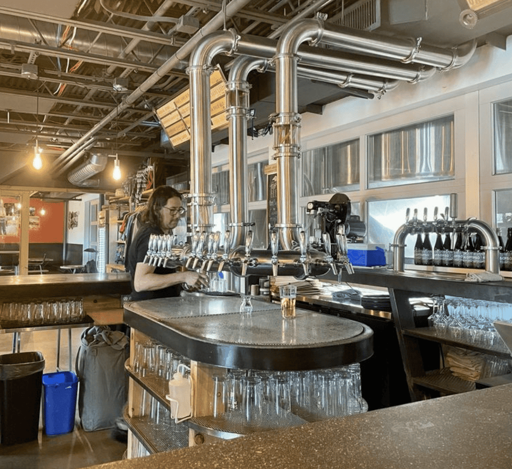Craft beer tap system at a modern brewery bar for beer enthusiasts.