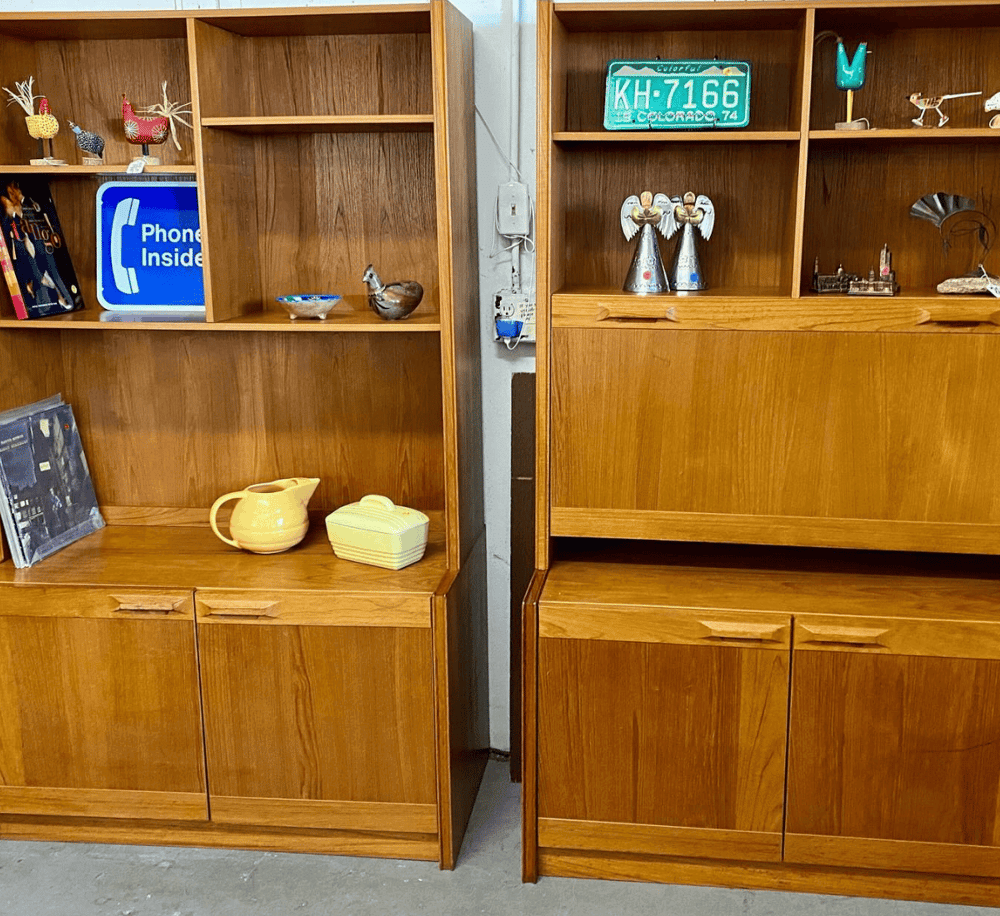 1. Vintage wooden bookshelves with decorative collectibles and memorabilia.