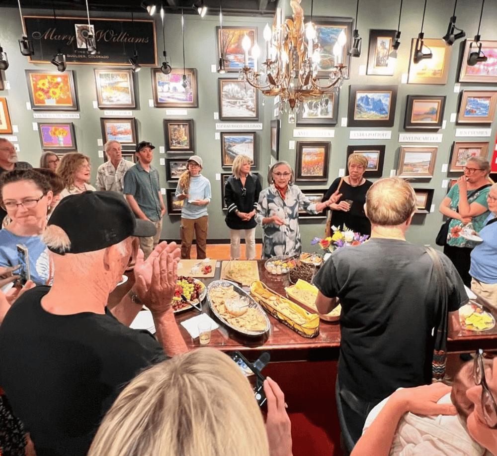 Art gallery art exhibition at QuestForDirections in Boulder Colorado showcasing local paintings and community engagement photoshoot.