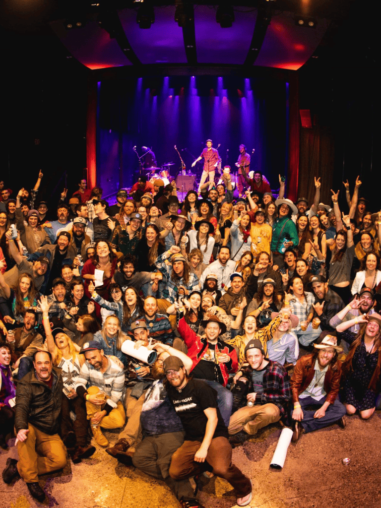 Vibrant concert crowd enjoying live music at QuestForDirections event.