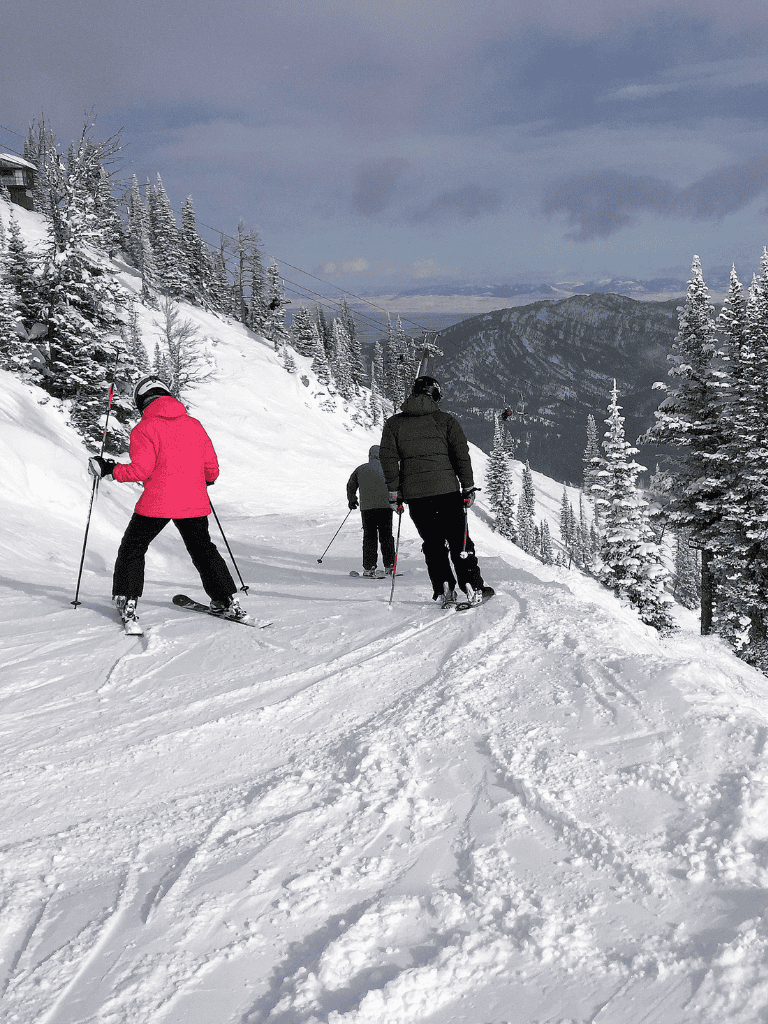 Beautiful winter snow scene with people skiing in scenic mountain landscape, perfect for winter sports enthusiasts.