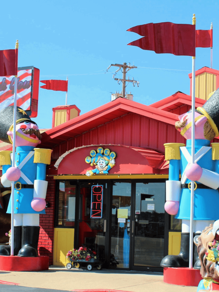 Colorful toy soldier and carnival-themed entrance at QuestForDirections, a fun map and direction store.