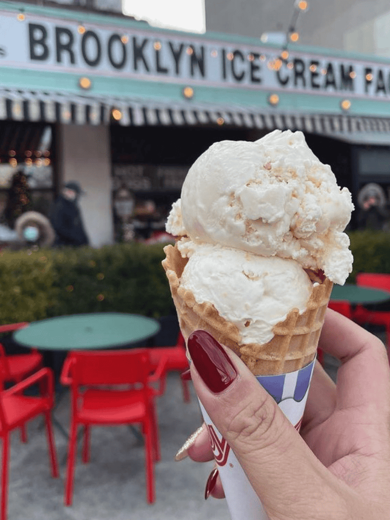 Cold ice cream cone outside Brooklyn Ice Cream Factory in NYC.