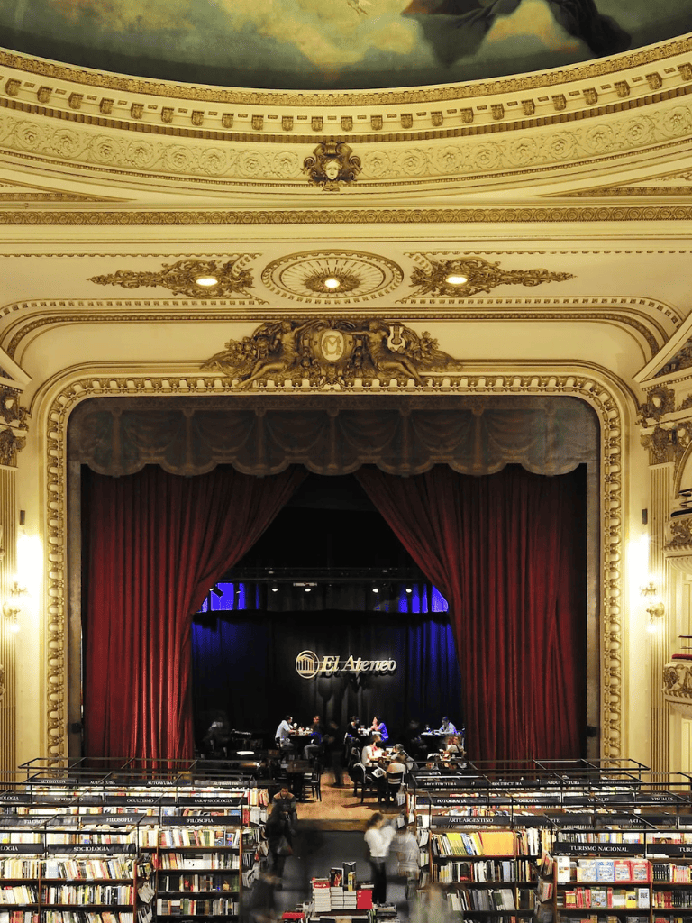 Historical theater interior with elegant architecture and a live performance stage, perfect for cultural events and concerts.