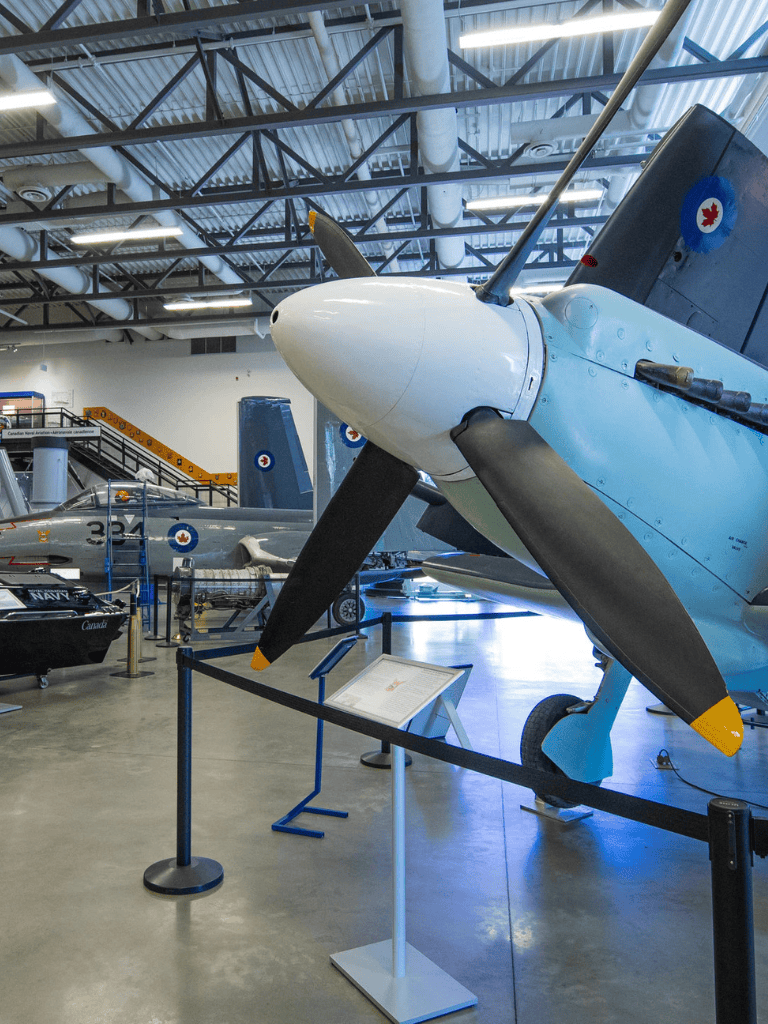Vintage aircraft display at QuestForDirections aviation museum, showcasing military and civilian planes.
