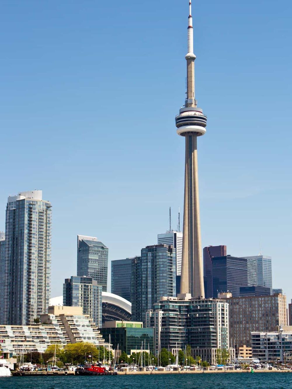 Iconic Toronto skyline featuring the CN Tower and modern high-rise buildings.