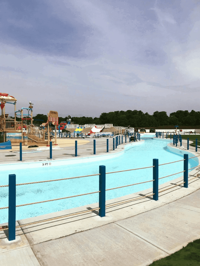 Quiet Outdoor Water Park with Lazy River and Water Slides, Family-Friendly Recreation Area.
