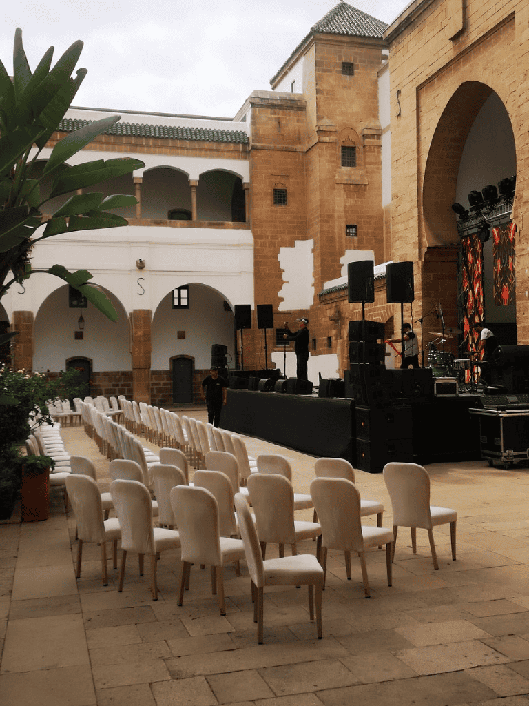 Relaxing outdoor event space with stage and seating for concerts or performances at QuestForDirections.