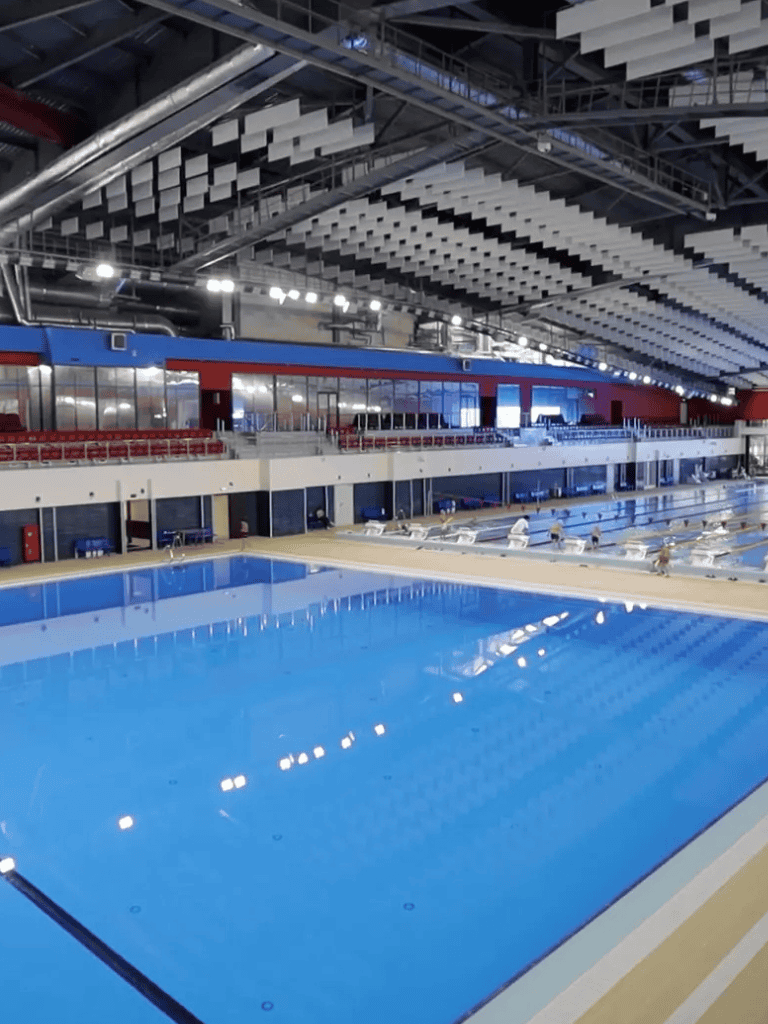Indoor Olympic-sized swimming pool at QuestForDirections sports complex.