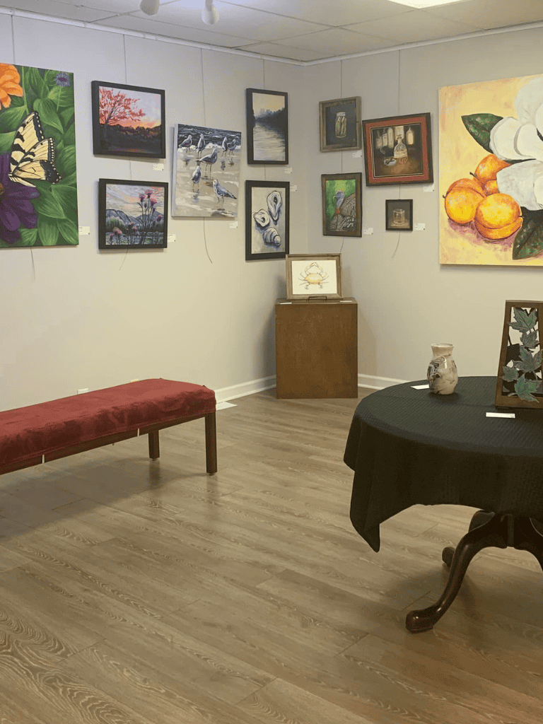 Vibrant art gallery featuring diverse paintings and framed artwork at QuestForDirections.