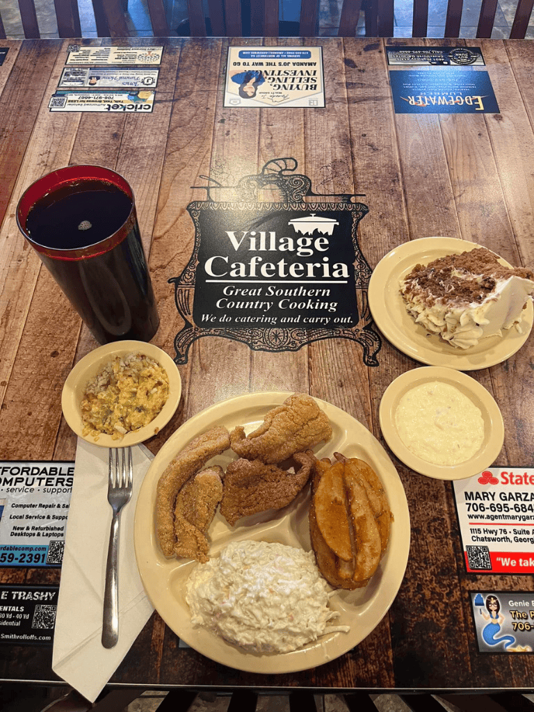 Cold drink with Southern country fried chicken and mashed potatoes at Village Cafeteria.