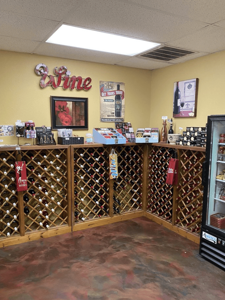 1. Wine rack display with variety of wines and promotional signage.