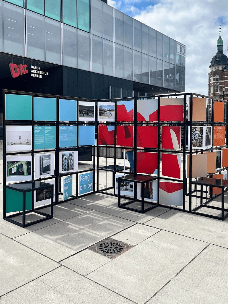 Modern outdoor art installation with colorful panels and architectural displays in Copenhagen.